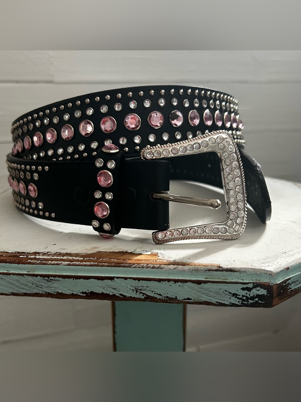 Pink rhinestone black vegan belt, size large. Bling on silver buckle.
